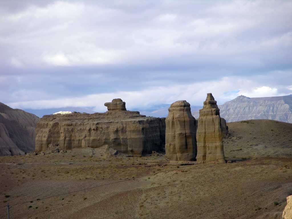 Tibet Guge 01 To 14 Sutlej Canyon Natural Palace The sandstone cliffs of the Sutlej canyon have eroded into some fantastic shapes, like what looks like a palace of buildings.